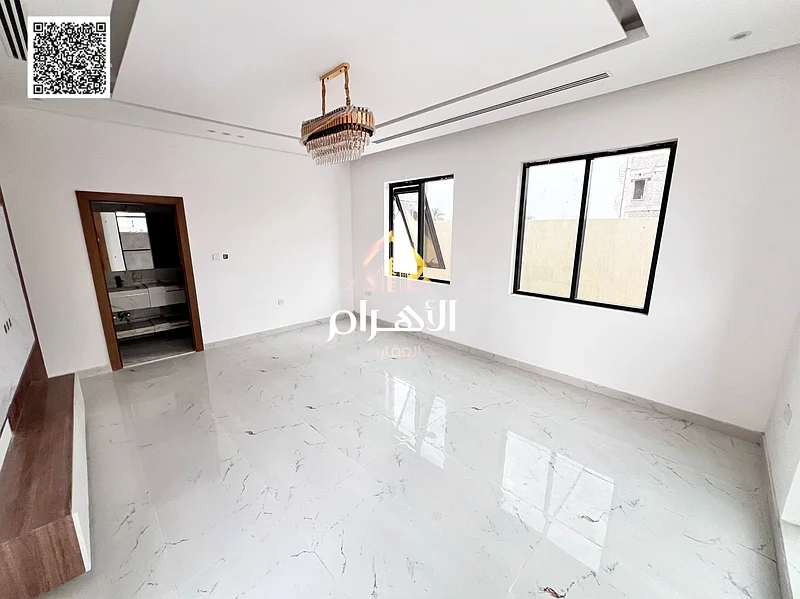 For sale, a two-story villa with a large courtyard - including registration and ownership fees - close to Sheikh Mohammed bin Zayed Road - freehold fo63903823298306114