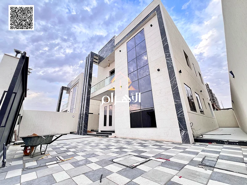 For sale, a two-story villa with a large courtyard - including registration and ownership fees - close to Sheikh Mohammed bin Zayed Road - freehold fo63903823298306112