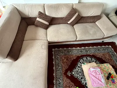 Stylish L-Shaped Sofa with Decorative Cushions