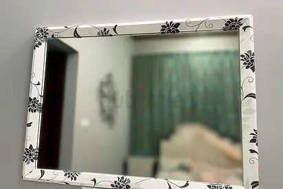 White mirror with black flowers