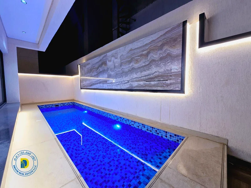 Modern villa with elevator and swimming pool for sale in Al Helio 2, Ajman, 5 rooms, price includes central air conditioning63907700921985113