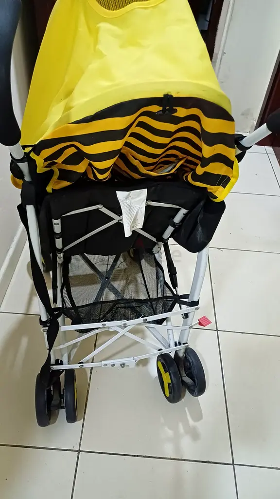 Lightweight Yellow Stroller for Effortless Walks!