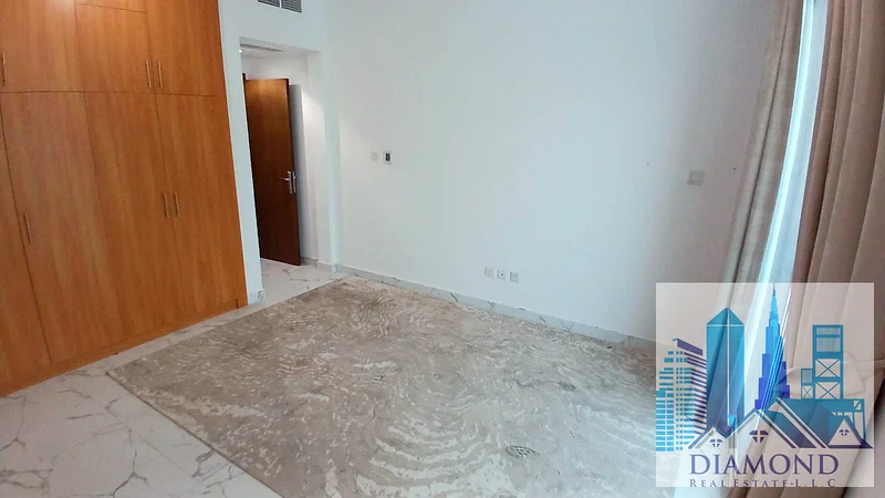 For sale, in installments, in oasis Towers, Ajman, a two-bedroom apartment with a full water view of Ajman Creek.63888048116739112