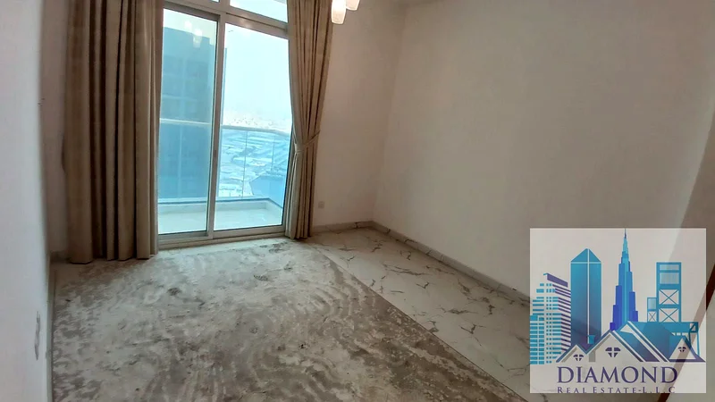 For sale, in installments, in oasis Towers, Ajman, a two-bedroom apartment with a full water view of Ajman Creek.63888048116739113