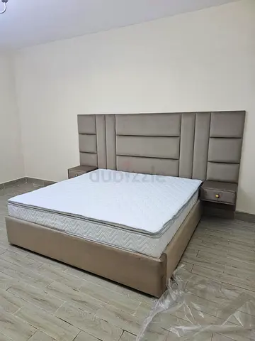 Luxurious King Size Bed with Elegant Headboard