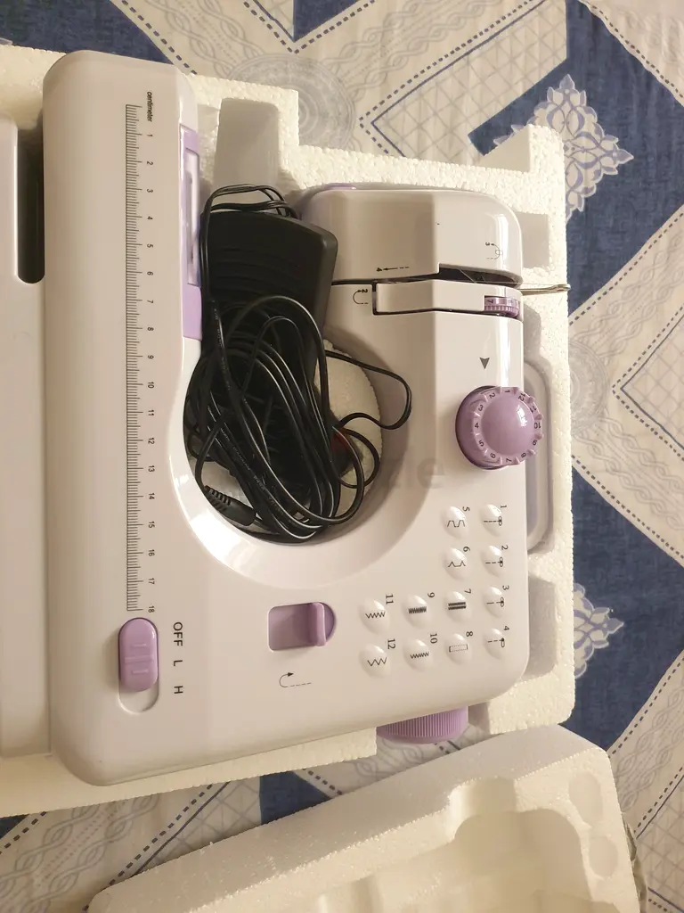 Compact and Stylish Sewing Machine for Quick Repairs!
