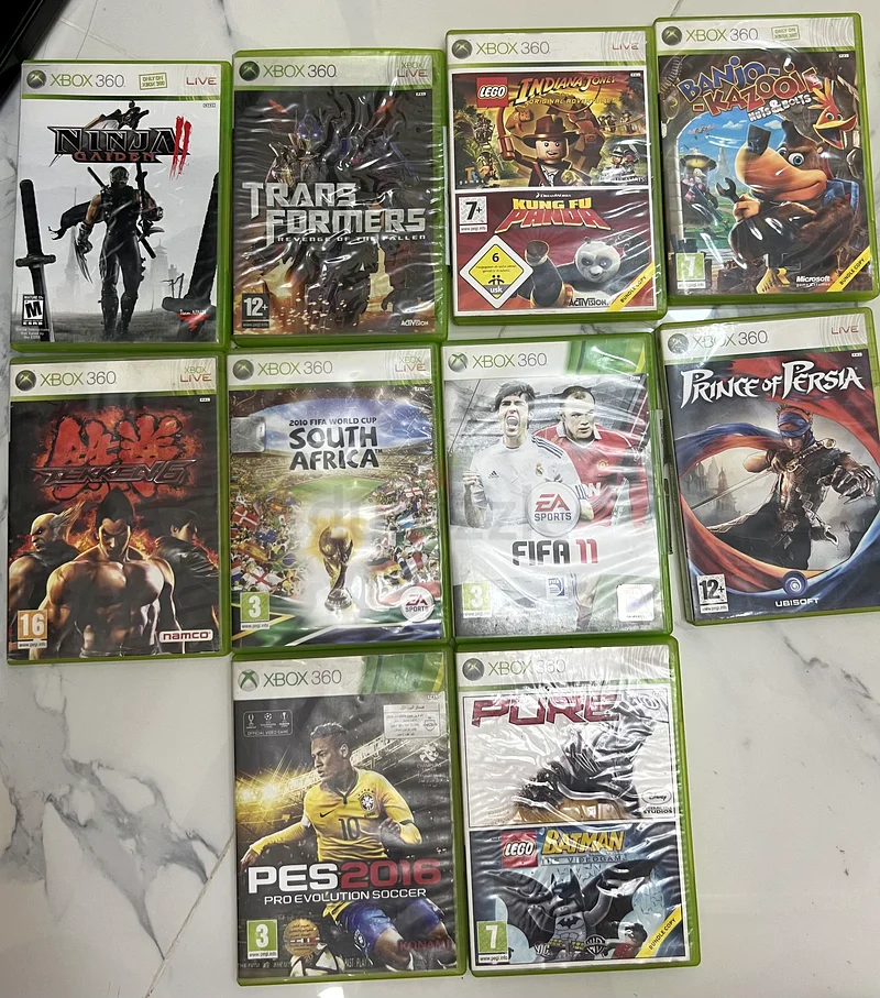 طقم مكون من 4 أجهزة تحكم Xbox 360 و10 ألعاب على قرص مدمج - مثالي لمتعة اللعب الجماعي!63229303409283111