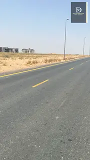 Residential land for sale in Sharjah, Al Matraq area, distinguished location