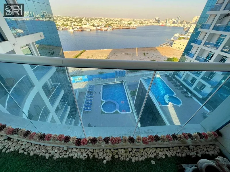 apartment for sale in Al Waha Tower 2 – Ajman, stunning creek view, prime location, high-end finishing, close to all amenities, an investment op63890250429057110