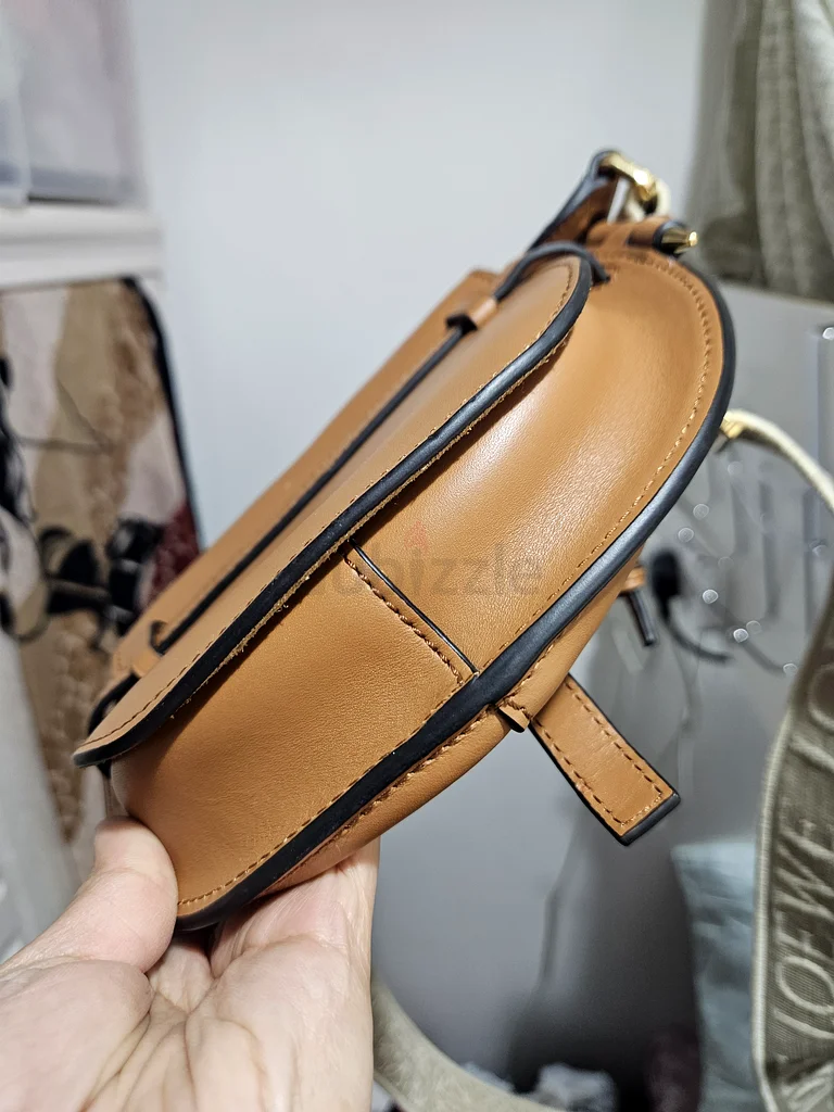 Stylish Brown Crossbody Bag with Unique Design63239619482369114