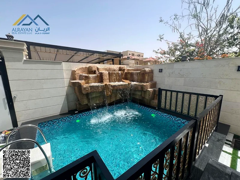 Villa for sale in Al Muwaihat 1, Al Tallah Street, 5,000 square feet, consisting of 6 master bedrooms, a suite, a living room, and a swimming pool.63869813942273114