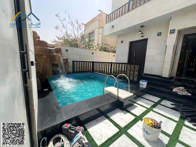Villa for sale in Al Muwaihat 1, Al Tallah Street, 5,000 square feet, consisting of 6 master bedrooms, a suite, a living room, and a swimming pool.63869813942273110
