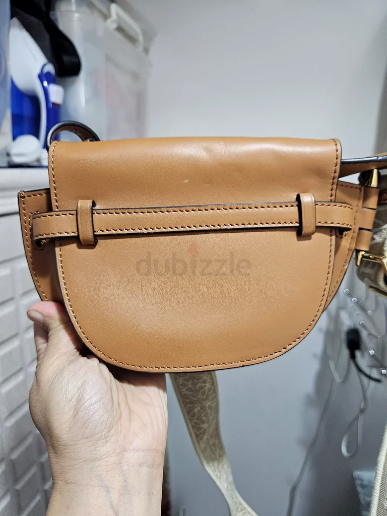 Stylish Brown Crossbody Bag with Unique Design63239619482369113