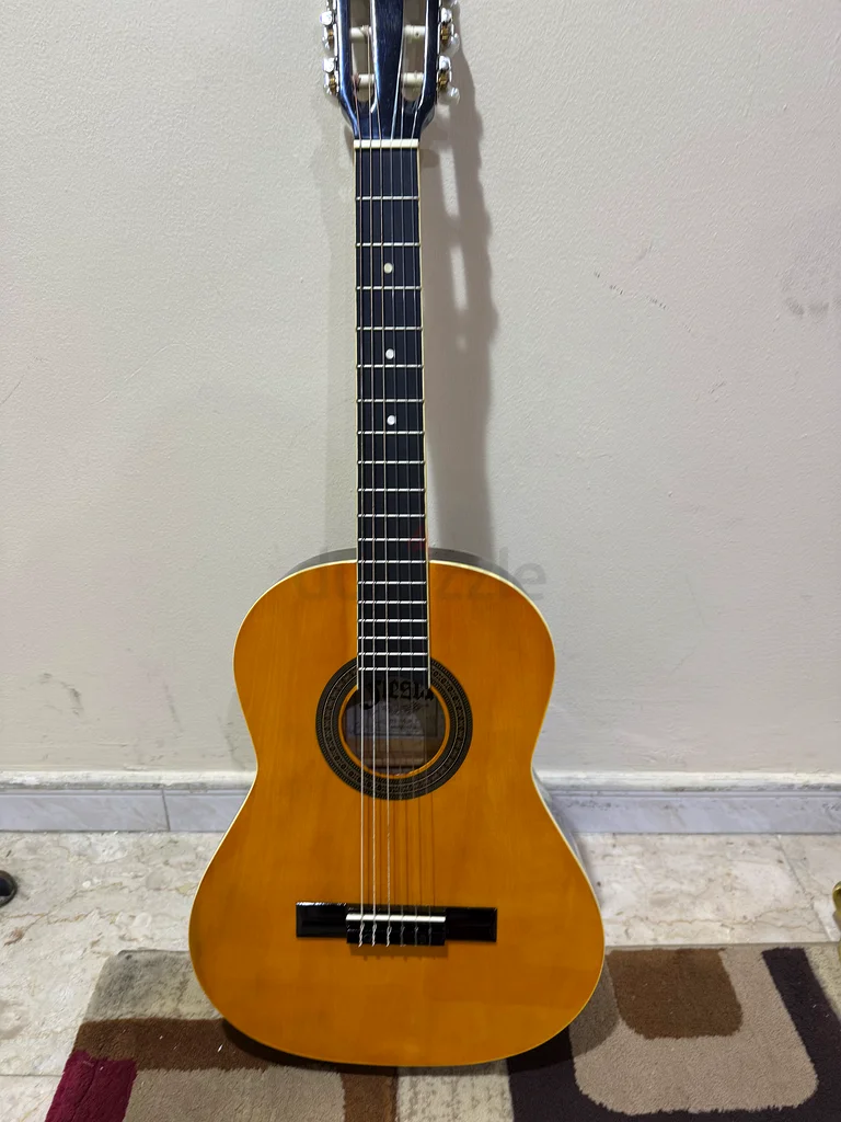 Two wooden guitars, one full size and one smaller educational size for children, in excellent condition, almost new, plus 2 extra sets of strings as a gift63229302005634114