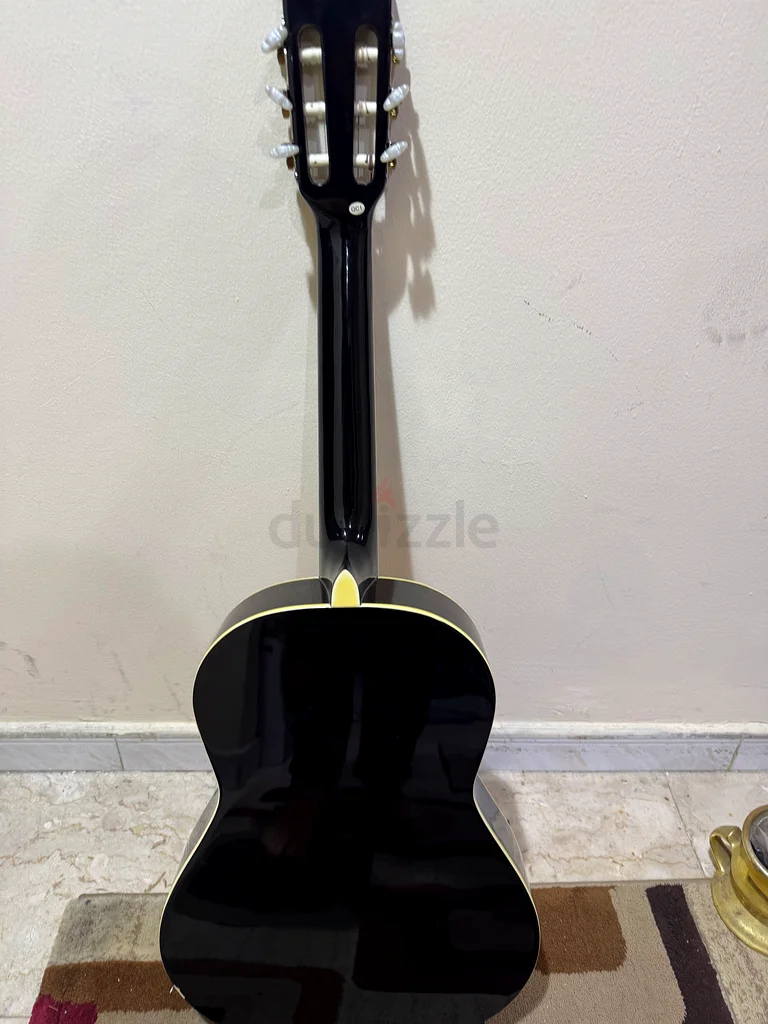 Two wooden guitars, one full size and one smaller educational size for children, in excellent condition, almost new, plus 2 extra sets of strings as a gift63229302005634113
