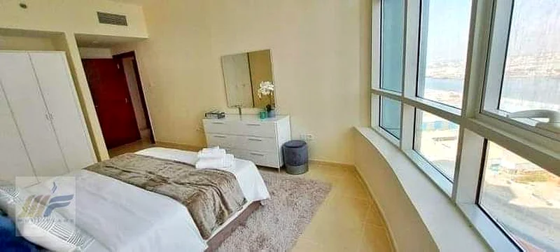 شقة مكونة من غرفتين نوم وصالة للبيع في برج أورينت مع خطة دفع63170398724867114