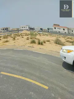 For sale in Sharjah, Al Suhaima area, Al Siouh suburb, residential land, corner, on two streets, are