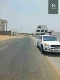For sale in Sharjah, Al Hoshi area Residential land area of ​​20,000 square feet A pnd first vil