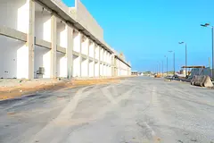 Commercial building in Al-Helio -4 shops- including fees &amp; registration