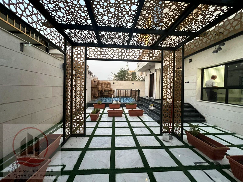 Villa for sale in Ajman, Al Muwaihat 1 area, ground floor, first floor and roof, including electricity, water and air conditioning (swimming pool + 763869383455233112
