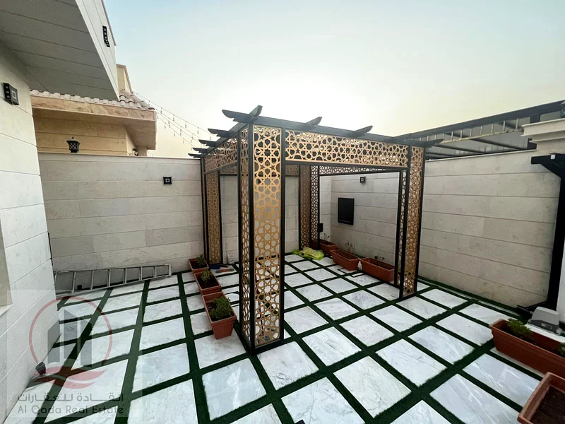 Villa for sale in Ajman, Al Muwaihat 1 area, ground floor, first floor and roof, including electricity, water and air conditioning (swimming pool + 763869383455233113