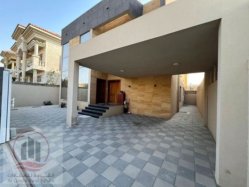 Villa for sale in Ajman, Al Muwaihat 1 area, including electricity, water and air conditioning, 5000 square feet (5 master bedrooms + majlis + hall +63869383446913112