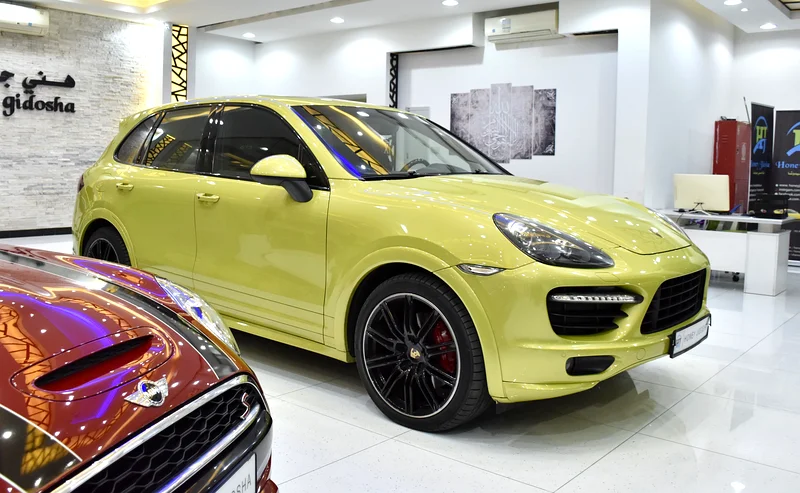 EXCELLENT DEAL for our Porsche Cayenne GTS (2013 Model) in green color, GCC specs63150023122945112