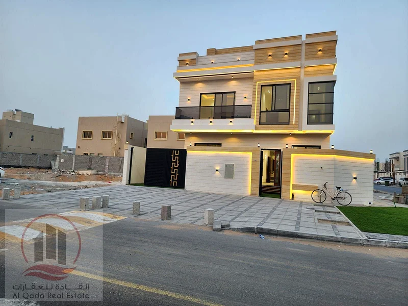 Corner villa for sale in Ajman, Al Helio 2 area, including registration fees, ground floor, first floor, and roof (5 master bedrooms + majlis + hall +63891799478402111