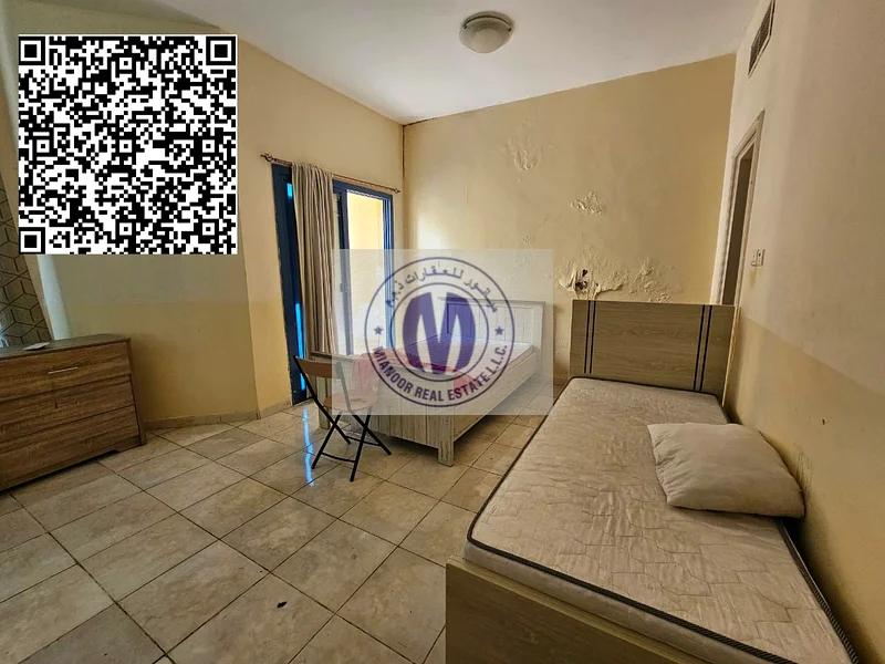 شقة فسيحة فارغة مكونة من غرفتي نوم ومجلس متاحة للبيع في أبراج الخور، عجمان...63256057963779112