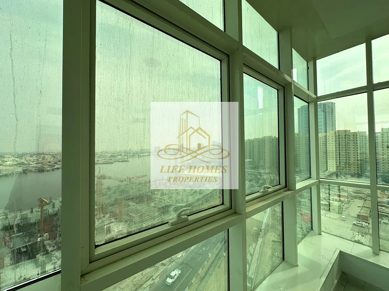 شقة فاخرة مكونة من غرفتي نوم للبيع في برج الواحة، عجمان – بإطلالة كاملة على الخور!63887838456323112