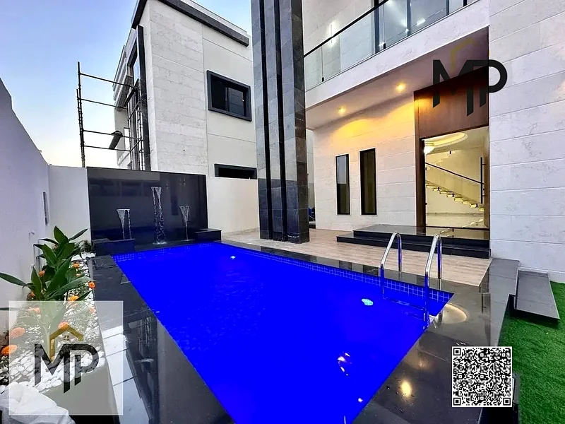For sale - a luxury villa with a swimming pool in a prime location in Ajman, high-end finishing, modern design, including registration and owners63880932761985111