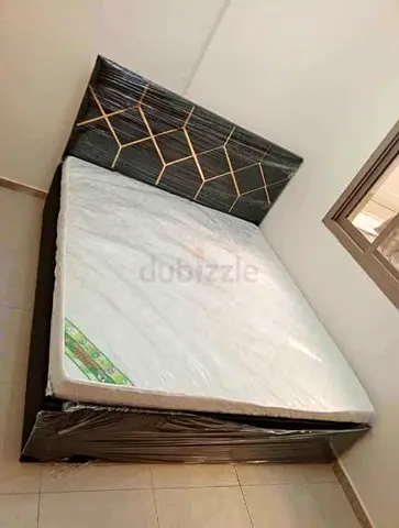 King size new bed with mattress for sale.
