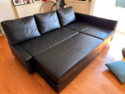Black leather sofa bed