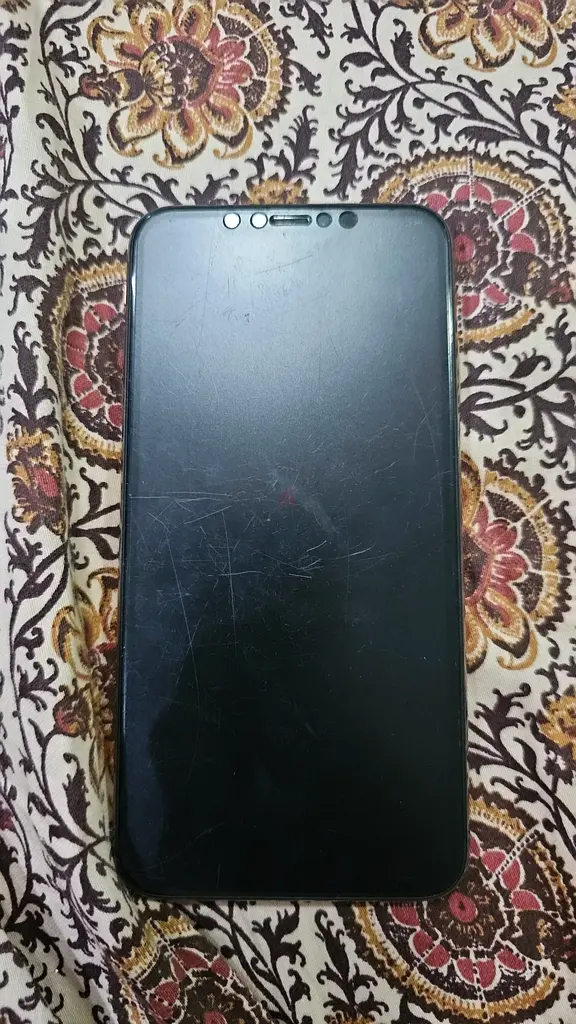Sleek Mobile Phone with Minor Scratches on protector not screen - Great Deal!