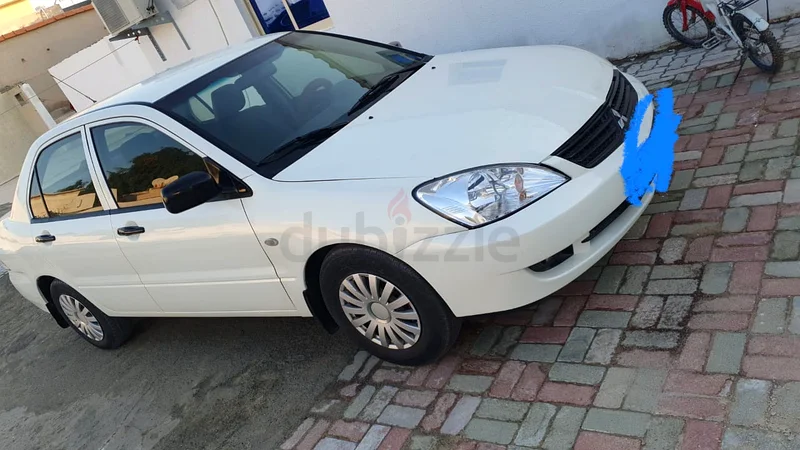MITSUBISHI LANCER 2010 WITH VALID MULKIYA  TILL JUNE 2026 AVAILABLE FOR SALE.63172651069698114