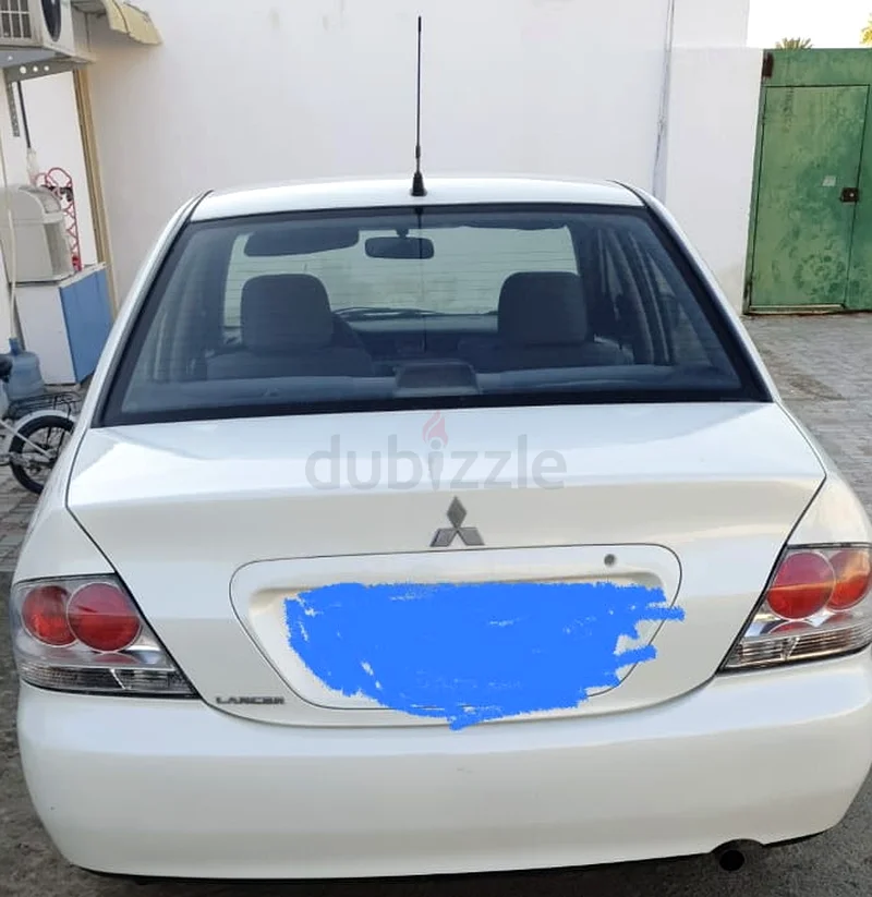 MITSUBISHI LANCER 2010 WITH VALID MULKIYA  TILL JUNE 2026 AVAILABLE FOR SALE.63172651069698113