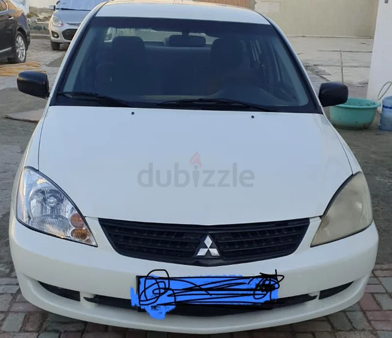 MITSUBISHI LANCER 2010 WITH VALID MULKIYA  TILL JUNE 2026 AVAILABLE FOR SALE.63172651069698112