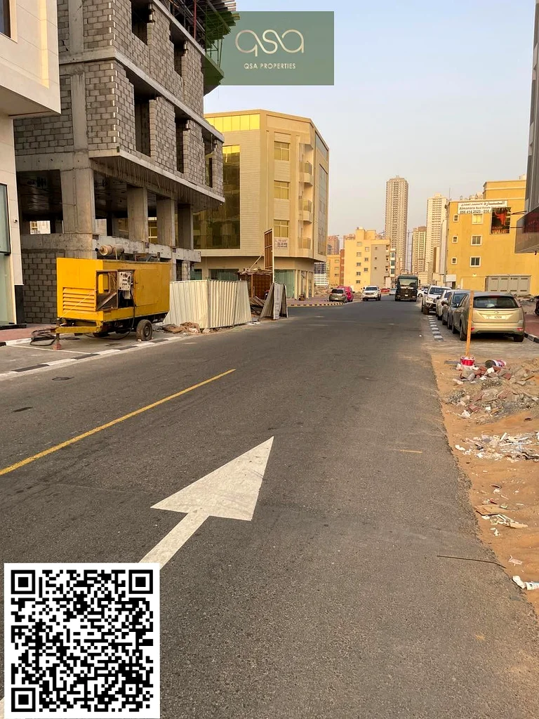 أفضل موقع | قطعة أرض تجارية وسكنية بمساحة طابق أرضي وثلاثة طوابق للبيع في منطقة ال علية، عجمان63199122520835113