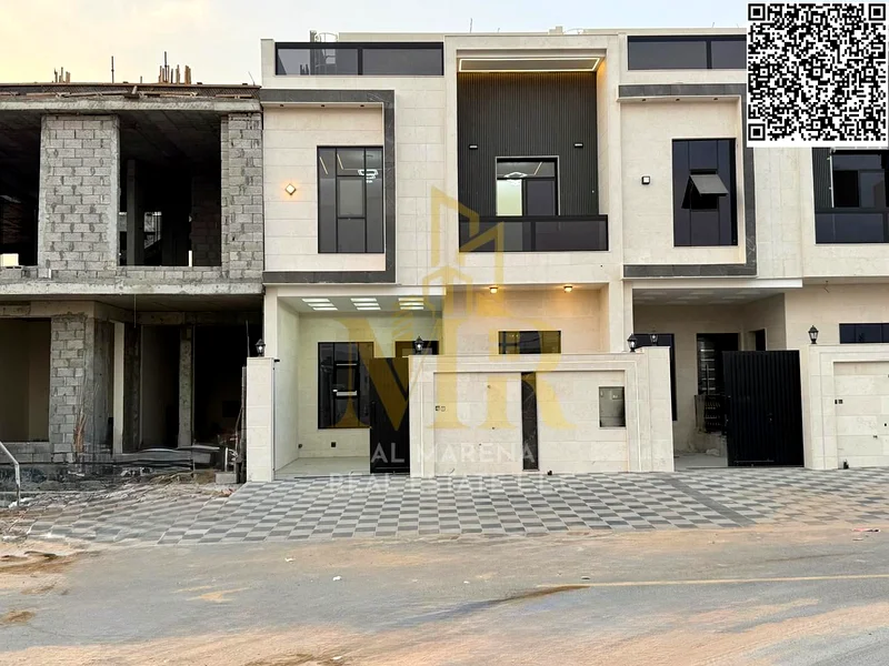 For sale in Al Harba, Ajman, a modern design, luxurious two-story townhouse villa with a roof, first resident in Al Helio 2, including registration an63898772812289111