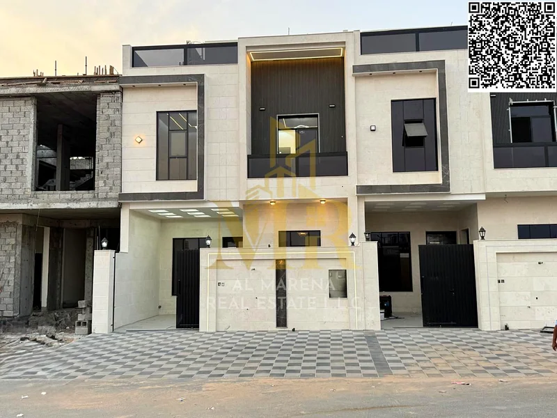 For sale in Al Harba, Ajman, a modern design, luxurious two-story townhouse villa with a roof, first resident in Al Helio 2, including registration an63898772812289110