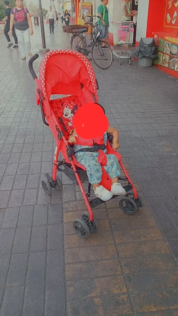 Charming Red Stroller for Your Little One!