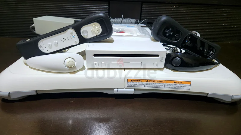 Nintendo Wii with Wii Fit Balance Board,2 controllers and 45 loaded games63231194935683111
