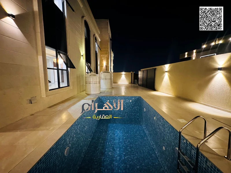 فيلا ركنية كلاسيكية أمام مجتمع أزها، بمساحة 4200 قدم مربع، مع مسبح كبير63899978710914111