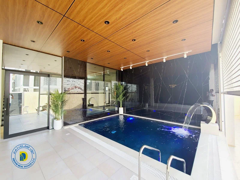 Elite villa , 5BR corner  with a swimming pool and a roof, including reg fees, in AL Bahia , super deluxe finishing, freehold, bank financing63881266064641114