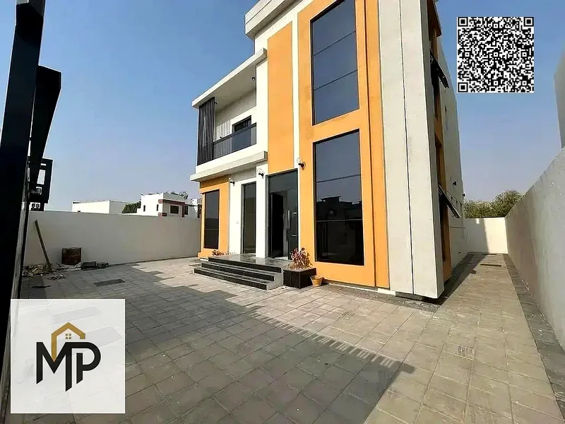 Own a luxurious villa in Al Helio 2, Ajman, at an attractive price, including registration fees, in a prime location, with elegant finishes and all am63899001712003111