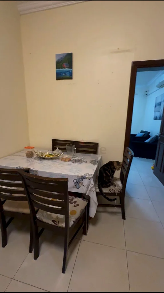 A large room with a balcony overlooking Khalifa.63143497290498111