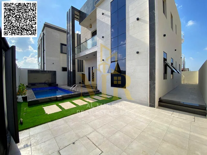 For sale - a luxurious villa with a swimming pool in a prime location in Ajman, featuring high-end finishing and modern design, including registration63898671242626114