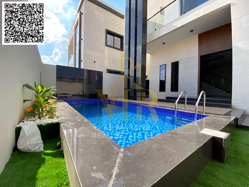 For sale - a luxurious villa with a swimming pool in a prime location in Ajman, featuring high-end finishing and modern design, including registration63898671242626110