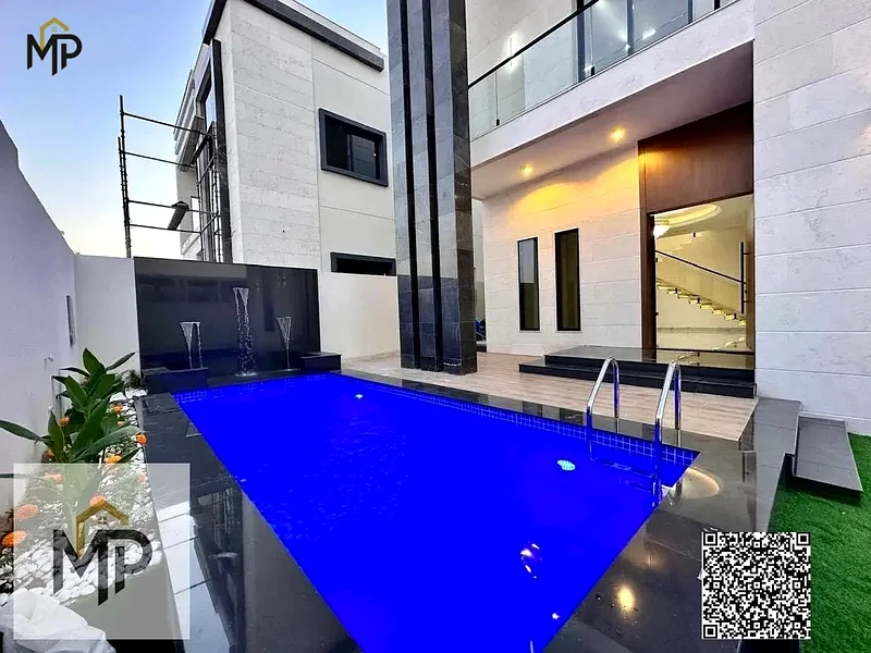 For sale - a luxury villa with a swimming pool in a prime location in Ajman, high-end finishing, modern design, including registration and swimming63899337053443111