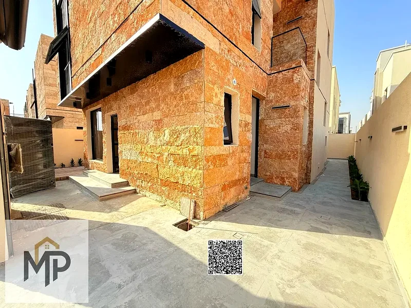Villa for sale - two floors and a large courtyard - close to Sheikh Mohammed bin Zayed Road - freehold for all nationalities for life -63171304767233113